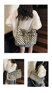 Detail of checkered tote bag with multiple zip pockets and adjustable shoulder strap
