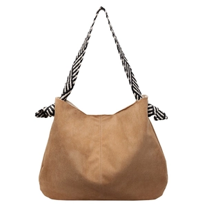 Brown suede tote bag with striped woven knot shoulder straps and spacious trapezoid design