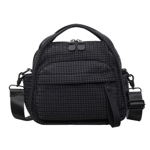 Black and white checkered nylon crossbody bag with adjustable wide shoulder strap