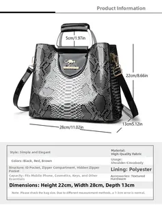 Detail of snake print texture and gold logo on a high-capacity crossbody handbag