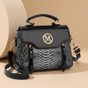 Fashionable snake pattern handbag with black lacquer flap and golden M logo detail