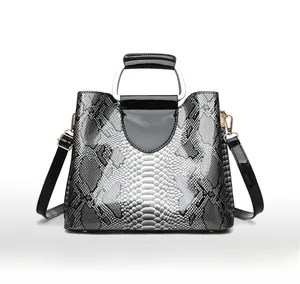 Rear view of sleek snakeskin pattern handbag with silver metal handle and glossy texture