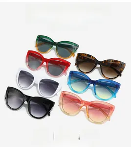 Flat lay of retro cat eye sunglasses in seven vibrant colors and glossy finishes
