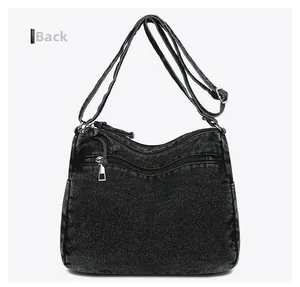 Vue arrière du sac bandoulière en denim noir avec poche zippée sécurisée et curseur en métal