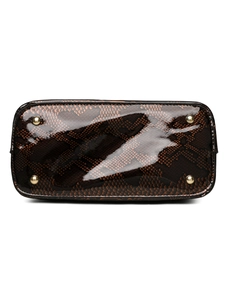Detail of snake skin texture handbag bottom with protective gold metal studs