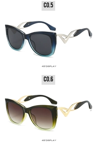 Detail view of cat-eye sunglasses featuring unique wavy metal temples and gradient frames