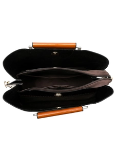 Detailed interior of black tote bag showing three compartments and brown lining