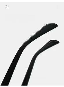 Detail view of ergonomic curved mirror legs on these black cat eye sunglasses