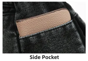 Vue détaillée de la poche latérale montrant un portefeuille en cuir dans un sac en jean noir
