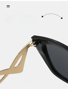 Macro view of durable metal hinge on cat-eye sunglasses with curved gold temples