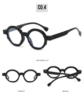 Detail view of round sunglasses with unique wavy textured temples in black glossy finish