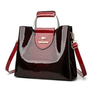 Elegant deep red snakeskin embossed patent leather handbag with silver arch metal handle