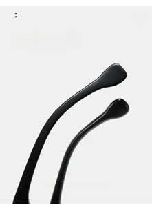 Macro detail of ergonomic curved black sunglass temples for comfortable wear