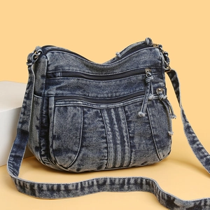 Sac bandoulière en jean bleu foncé vintage avec poches zippées et pompons à franges