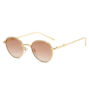 Retro oval sunglasses with gold metal frame and brown gradient lenses on white background