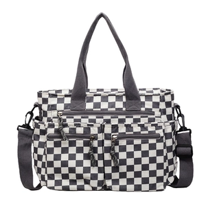 Checkerboard canvas tote bag with multiple pockets and adjustable shoulder strap