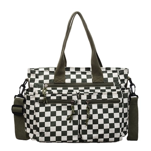 Green and white checkerboard tote bag with multi-pocket corduroy design and strap