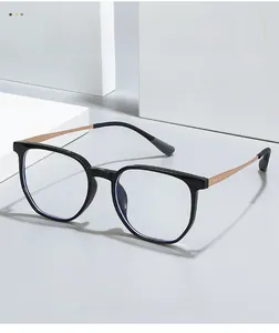 Detail of titanium glasses frames with golden metal temples and anti-slip grey tips
