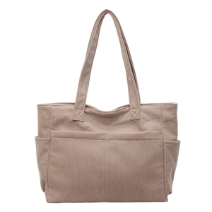 Large capacity corduroy tote bag in deep khaki featuring front and side pockets