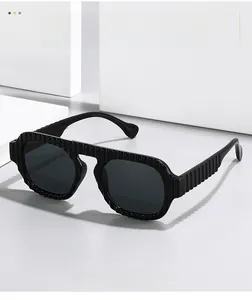Detail of pilot sunglasses showing the unique striped texture on the black frame