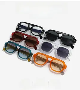 Flat lay of multiple stylish aviator sunglasses featuring textured striped frames
