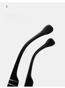 Detail of ergonomic curved black temple legs on vintage pilot sunglasses with polished finish