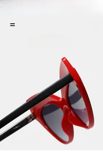 Detail of red cat-eye sunglasses with ultra-light elastic frame and hinge design