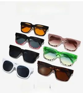 Collection of oversized square sunglasses in various colors and trendy floral patterns