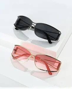 Detail view of Y2K rectangle metal sunglasses with dark and pink gradient lenses
