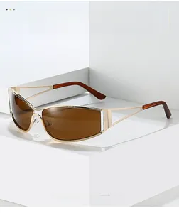 Detailed macro of gold metal frame sunglasses with gradient lenses and hollow temple arm