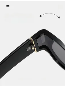 Detail of durable gold spring hinge on black square sunglasses with flexible folding