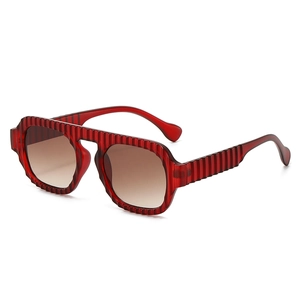 Retro aviator sunglasses with dark red ribbed frames and brown gradient lenses