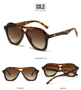 Detail view of tortoiseshell aviator sunglasses with gradient brown lenses and metal rivets