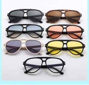 Detailed close-up of retro aviator glasses in seven colors with double bridge metal frame