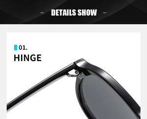Detailed close-up of the durable metal hinge and black frame of retro sunglasses