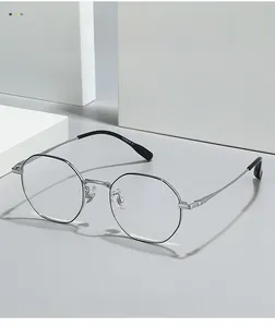 Detailed close-up of silver polygonal pure titanium eyeglass frame with IP coating