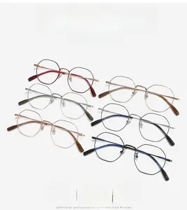 Polygonal titanium eyeglass frames shown in multiple colors with sleek metal finishes