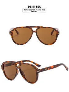 Detail view of demi-tea pilot sunglasses featuring vintage double bridge and tortoise frame