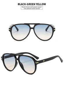 Detail of aviator sunglasses with black double bridge frame and green-yellow gradient lenses