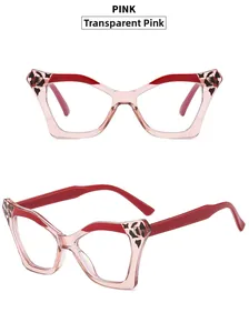 Detail view of transparent pink cat eye glasses with red temples and leopard print accents