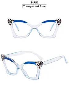 Detail view of transparent blue cat eye glasses with leopard print accents and clear temples