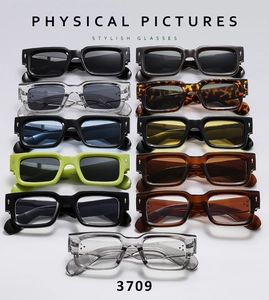 Flat lay display of thick square sunglasses in multiple colors with silver arrow hinge detail