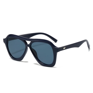 Retro oversized aviator sunglasses with navy blue frames and translucent blue lenses