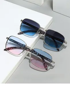Detail of vintage square sunglasses with silver metal frames and leopard print temples