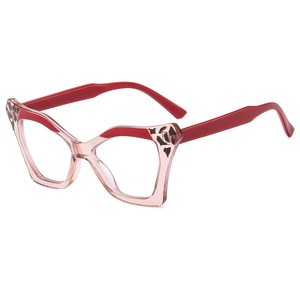 Oversized pink cat-eye glasses with leopard accents and red temples on white background