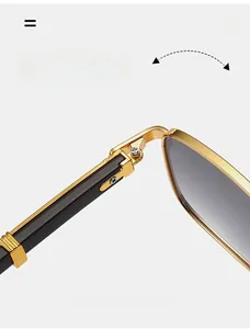 Detail of durable gold metal hinge and dark wood grain temple on square sunglasses