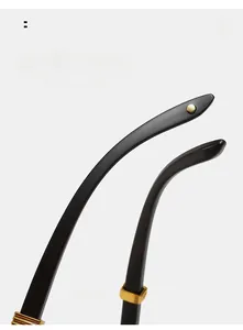 Detail of dark wood grain temples with gold metal rings for comfortable eyewear fit