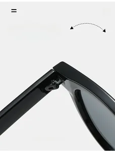 Detail of durable metal hinges on stylish black frame sunglasses for long-lasting use