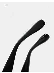 Detail view of black curved temples on sunglasses for comfortable and secure wear
