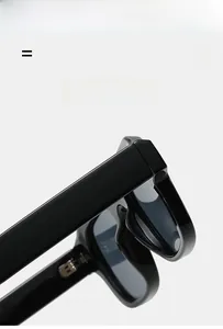 Detail of high-quality flexible metal hinges on lightweight black square frame sunglasses